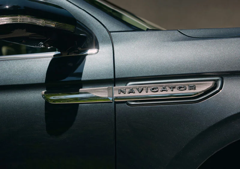 The side panel with the "NAVIGATOR" branding on the exterior of a 2024 Lincoln Navigator