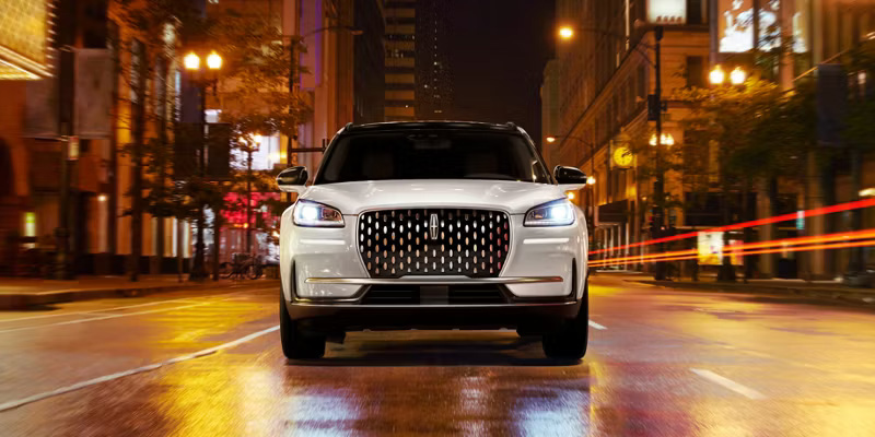 Certified Pre-Owned Lincoln Corsair® luxury SUV parked outside a Lincoln dealership.