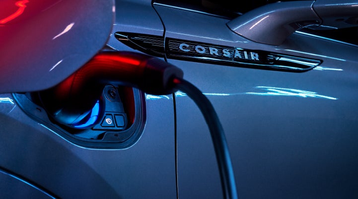 A charger plugged into the charging port of a 2024 Lincoln Corsair® Plug-in Hybrid model. | Bob Maxey Lincoln in Detroit MI