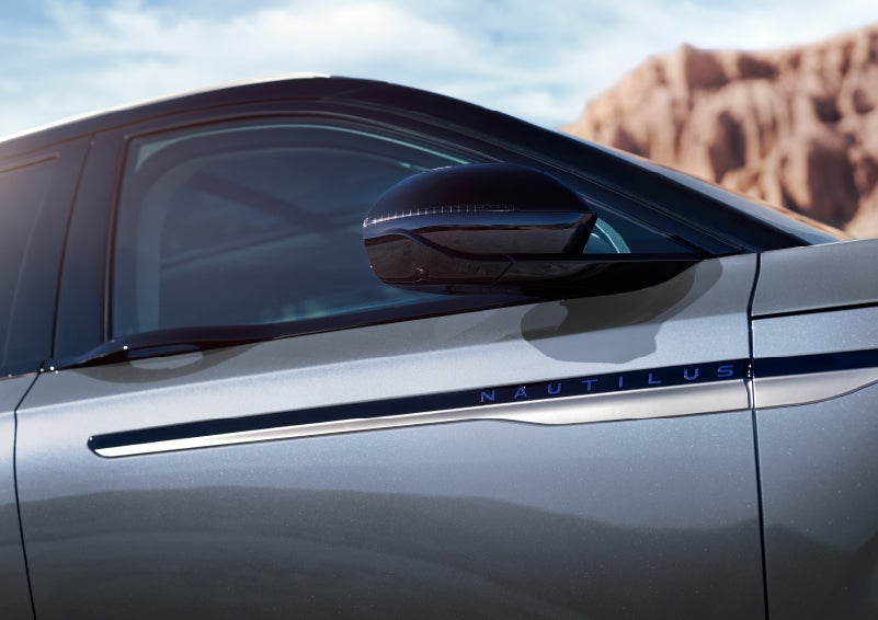 Blue lettering on the side of the vehicle that reads nautilus indicates the available hybrid powertrain. | Bob Maxey Lincoln in Detroit MI