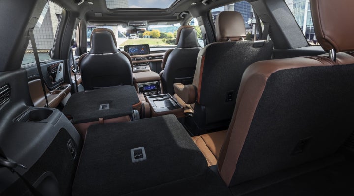 One side of the PowerFold® third-row seat and a second-row seat are folded forward in the 2026 Lincoln Aviator® SUV. | Bob Maxey Lincoln in Detroit MI