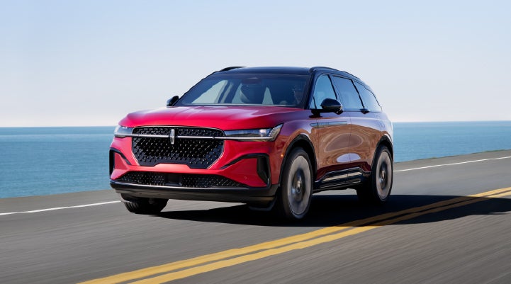 A 2026 Lincoln Nautilus® SUV is being driven on a seaside roadway. | Bob Maxey Lincoln in Detroit MI