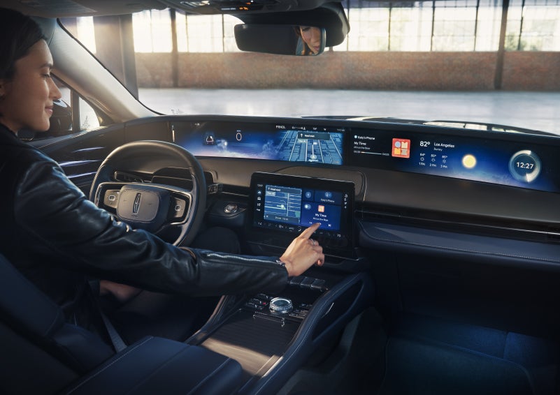 The driver of a 2026 Lincoln Nautilus® SUV interacts with the center touchscreen. | Bob Maxey Lincoln in Detroit MI