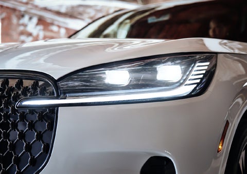 A close-up of a headlamp on the 2027 Lincoln Aviator® SUV is shown. | Bob Maxey Lincoln in Detroit MI