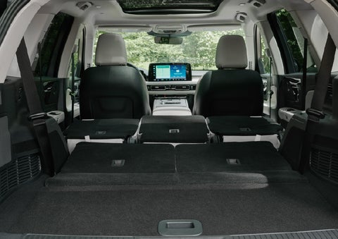 A rear to front view of the interior of a 2027 Lincoln Aviator® Black Label™ SUV shows the third and second rows folded flat | Bob Maxey Lincoln in Detroit MI